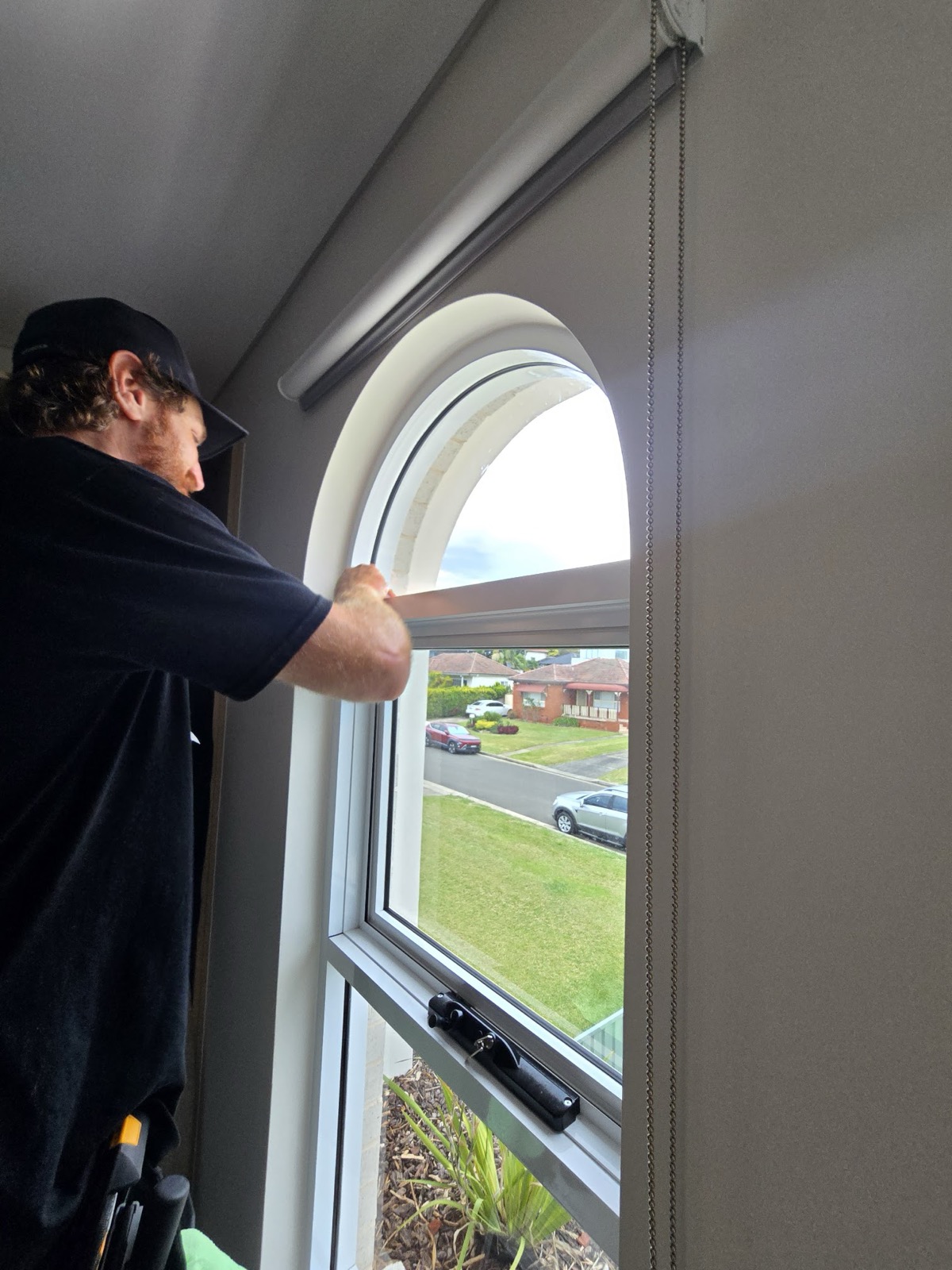 Detail work on an arched feature window