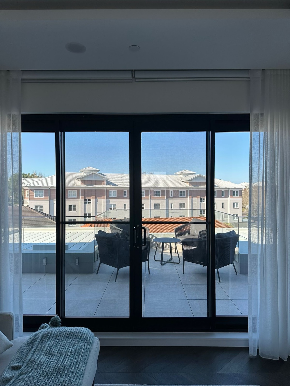 Tinted balcony sliding doors in a Sydney apartment
