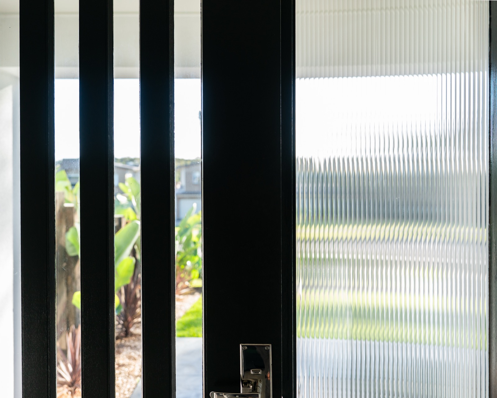 Applying protective film to an exterior door panel